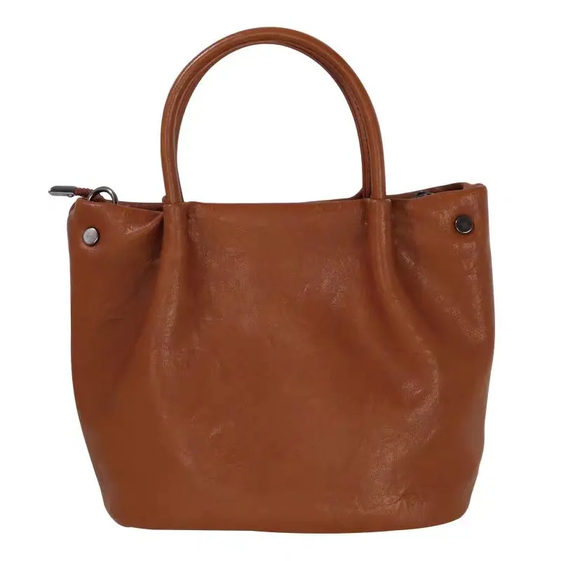 Outfit for going to work with a small handbag. Retro and high-end style shoulder bag. 2026 new model. Versatile and adjustable bucket bag.