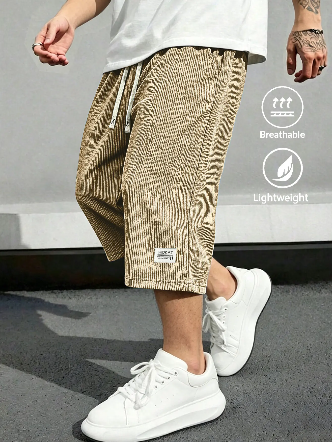 Men’s vertical ribbed knit 3/4 pants with elastic drawstring waist; lightweight, breathable, loose fit; casual jogging pants for streetwear and everyday wear; breathable, lightweight running pants; sports casual apparel; lightweight stretchy athletic swea