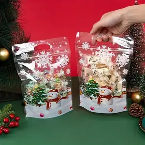 100 transparent plastic Christmas snowflake snack bags with red and green snowflakes, pine trees and candy bars-transparent gift bags suitable for cookies, candy and party decoration-ideal for holiday parties, New Year's Day, Thanksgiving Day and Christma