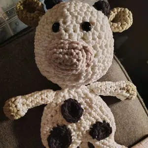 Crochet Cow Snuggler - Adorable Handmade Stuffed Animal with Unique Design and Soft Texture