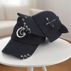 Y2K goth baseball cap with devil horns and cat ears, punk grunge pierced brim hat with metal rings and safety pin chain, adjustable black cotton cap for men and women, alternative fashion