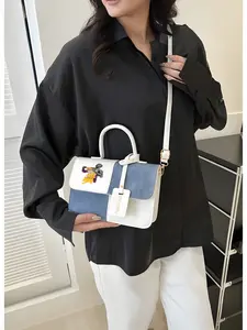 A basketball player showcases a stylish crossbody bag featuring a Lakers jersey number 24, perfect for commuting and travel – the ideal gift.