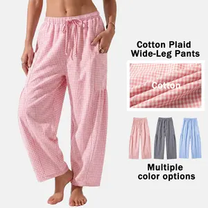 Women’s vacation-style small plaid wide-leg loungewear pants made of cotton with an elastic drawstring waist and side pockets; cloud-like softness, breathable, loose, and comfortable—ideal for sleeping, home office, everyday wear, and vacations.