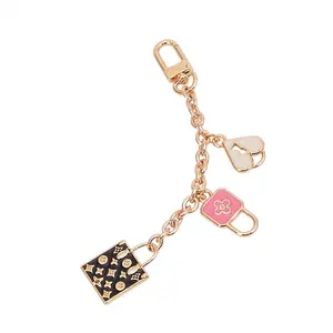 Gold Tone Three Charm Heart Lock 6 Inch Bag Charm Key Chain