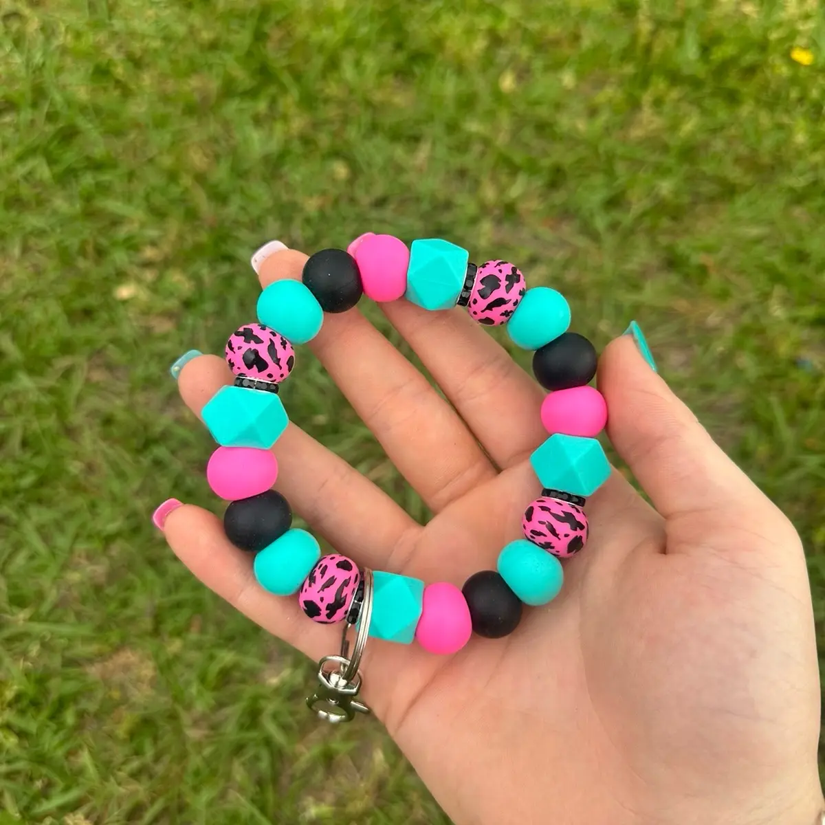 Hot pink and turquoise cow print wristlet !