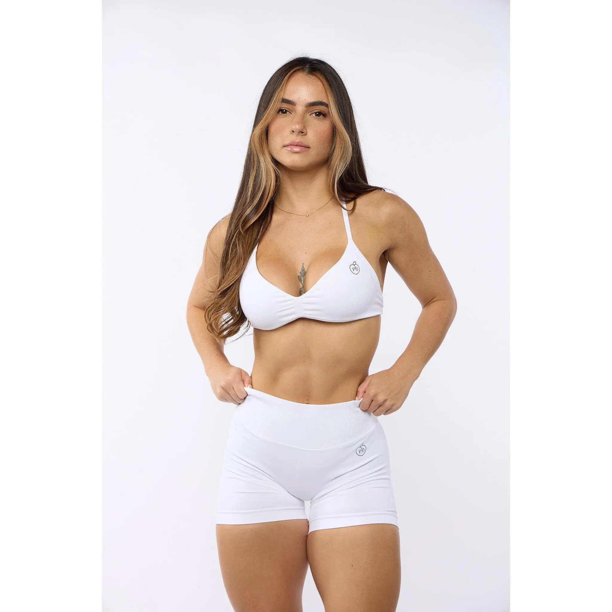 Women's White Bombshell 2-Piece Sports Set - Backless Tops, Stretch Fabric, Removable Pads, Scrunched Front, True Size Shaping Shorts