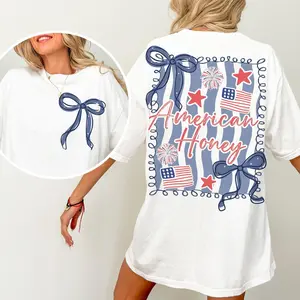 American Honey" Coquette Bow Graphic T-Shirt, Patriotic Ribbon & Firework Print Tee, Oversized Back Design Crew Neck Shirt, Trendy Red White Blue Aesthetic Cotton Tee for Women, 4th of July Fans and Coquette Lovers
