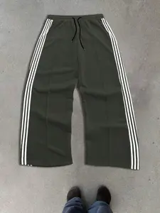 Mens american retro style green track pants with classic three white stripes on the sides and center front pleat design elastic drawstring waist loose wide leg fit breathable comfortable versatile trendy casual trousers