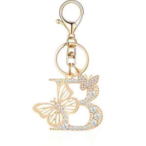 A Stylish And Luxurious Butterfly Keychain Featuring All 26 Letters of The English Alphabet, Adorned with Rhinestones And a Premium Golden Metal Initial. This Accessory Can Be Used As a Bag Charm Or a Car Pendant