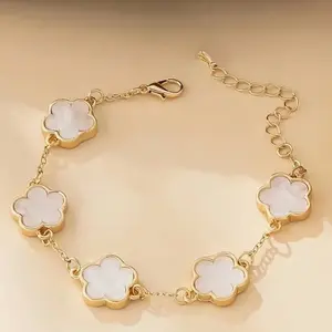 Golden Stainless Steel Bracelet with White Shell Flower Accents for Women