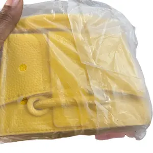 Yellow Leather Purse with Secure Closure and Clear Storage Option for Everyday Use