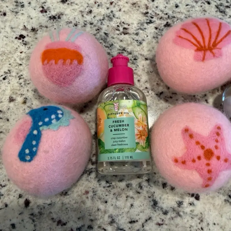 Pink Zebra Scented Oils with wool dryer balls. You pick your scent and dryer ball combo!