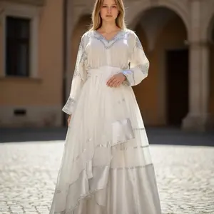 White Ethiopian Traditional Dress with Elegant Embroidery and Flowing Silhouette for Special Occasions ነጭ በነጭ እጅ ጥልፉ
