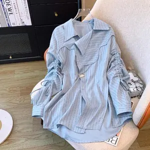 Early autumn new large-size women's clothing, high-end irregular loose blue striped long-sleeved shirt top