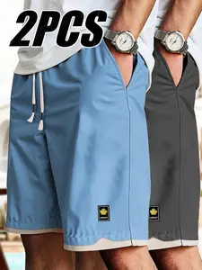 Pack of 2 unisex fashion casual shorts with side pockets and a drawstring waist for a comfortable fit; perfect for beach vacations, outdoor sports, and everyday outings.