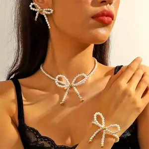 A set of 4 pieces of high-end French bowknot imitation pearl earrings, bracelets and necklaces, a ladies' jewelry set, suitable for daily wear at parties and banquets.