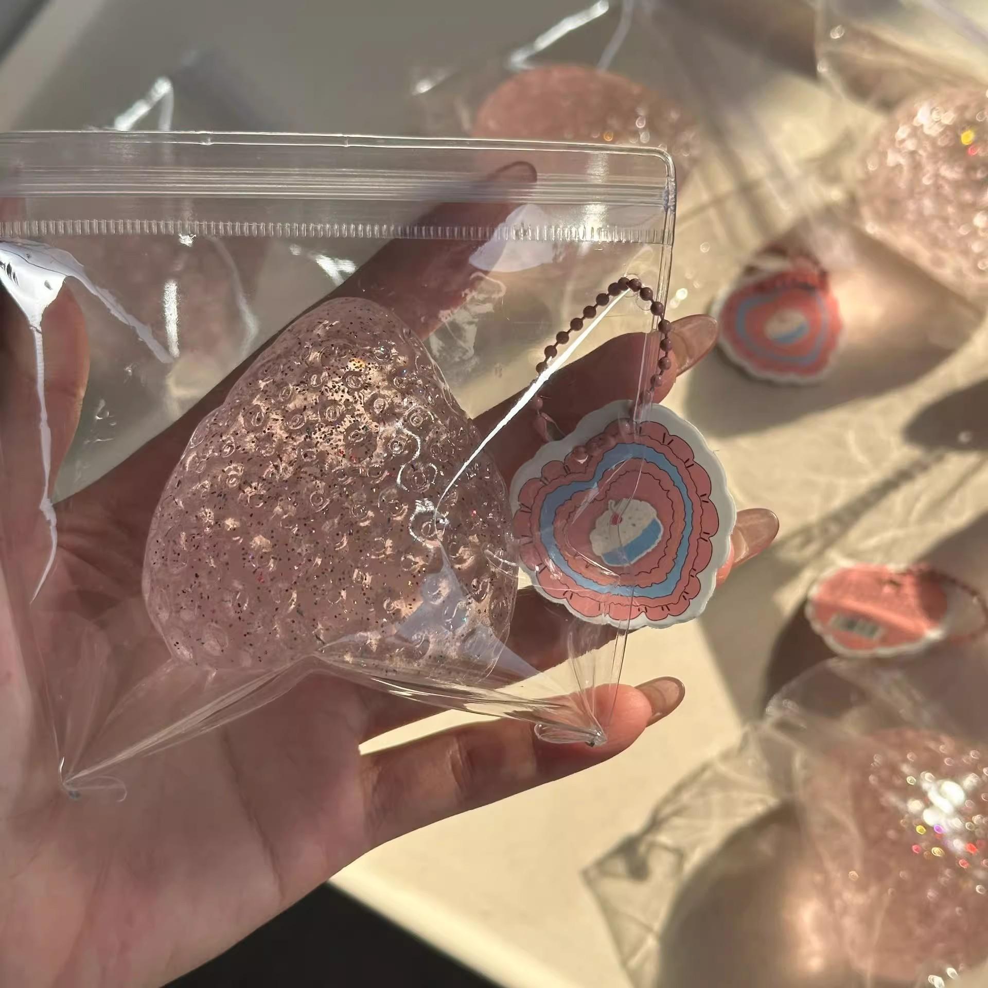 2-Pack adorable strawberry-shaped slow-rising squeeze ball; new strawberry squeeze toy; realistic strawberry-shaped stress relief ball—soft to the touch and effectively relieves stress; slow-rising stress relief toy with a moist, tactile texture.