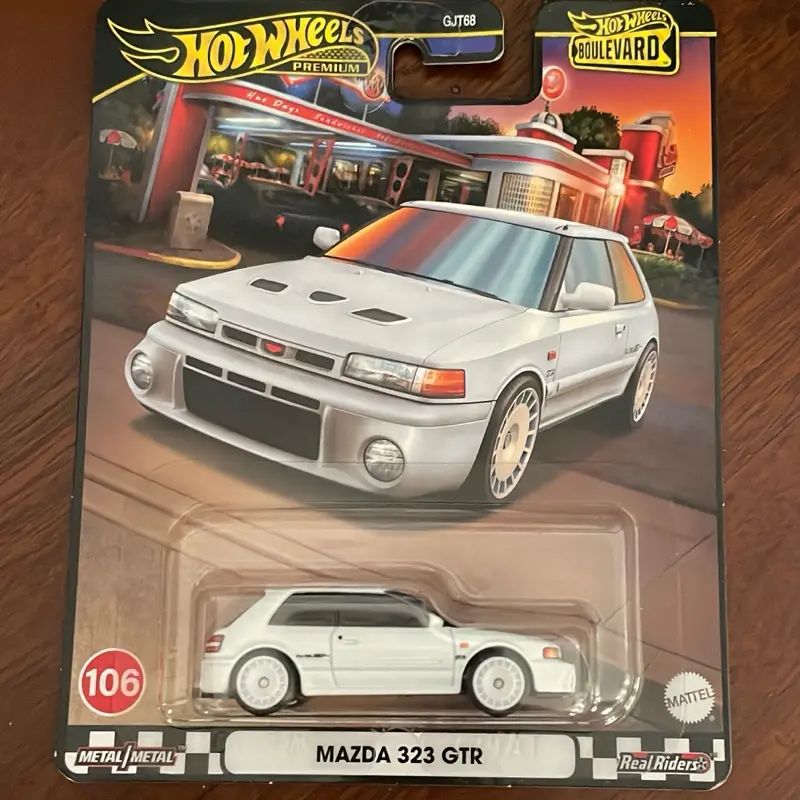 Hotwheels Premium Metal MAZDA 323 GTR - 106 Scale Model with Real-Life Features and Detailed Design