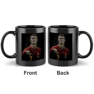 1pc 11oz black ceramic mug featuring the portrait of football player Cristiano Ronaldo, with a hand-drawn golden line design and double-sided printed logo of the football star, serving as a commemorative cup.
