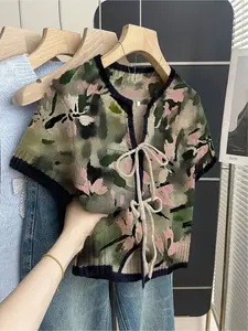 Women's khaki bohemian vacation short-sleeve knit top. Loose round neck, contrast patchwork ink-wash print, front tie and contrast piping. Comfortable for spring & summer casual chic wear.