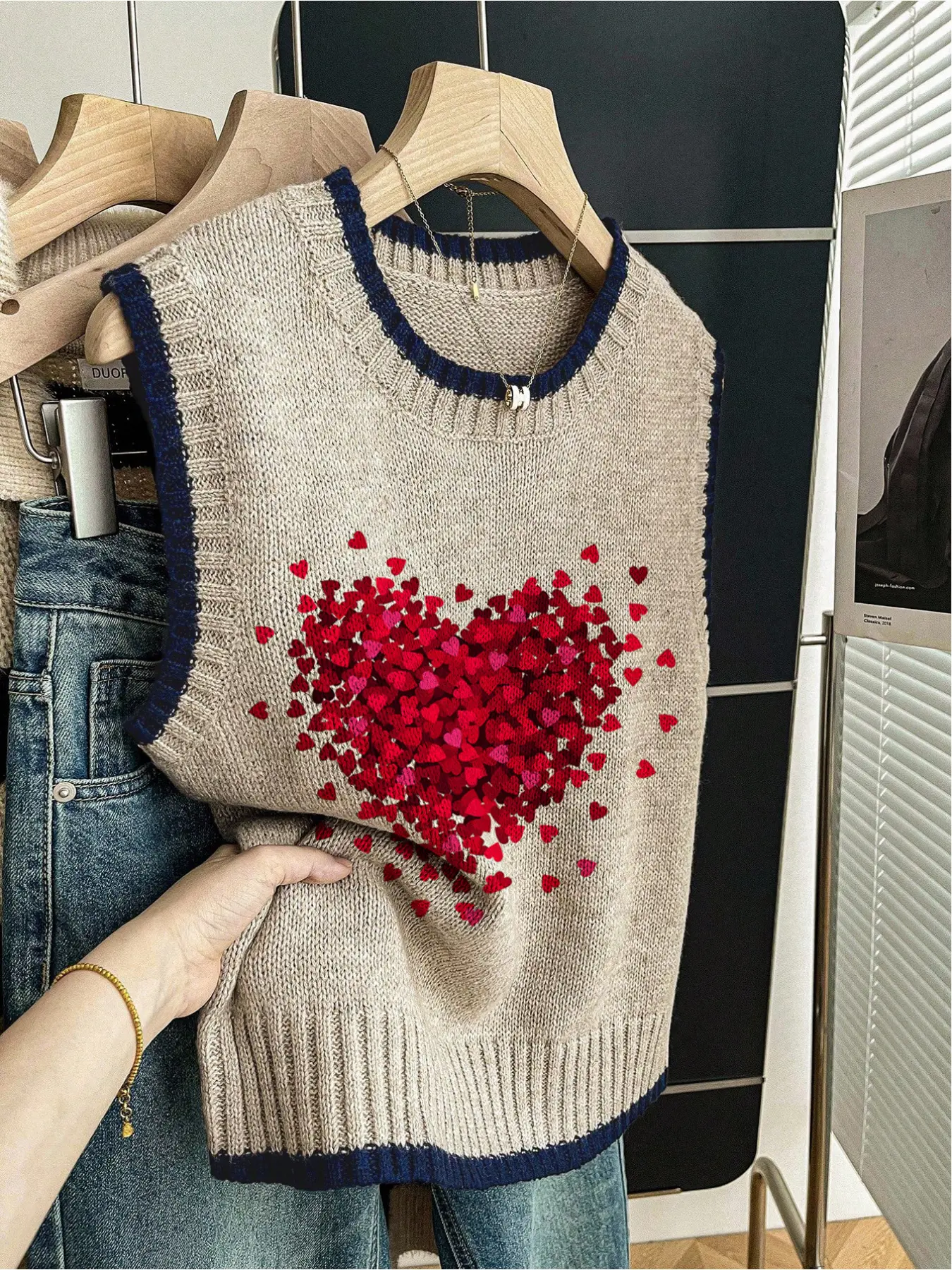 One spring/summer back-to-school knit top: loose fit, round neck, sleeveless. Features dark blue trim, color-block design, and heart-shaped prints for a Valentine's vibe. Wear solo or pair with a vest, ideal for casual outings or school.