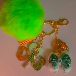 St. Patrick's Day Glitter Clover Leaf Keychain with Green Pom Pom, Gold Charm, and Cute Bow - Green Design, Keychain Style
