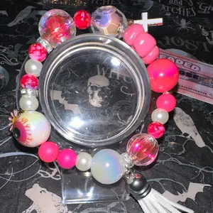 Pink Petal Beaded Bracelet with Skull Charm and Colorful Beads Including Eyeball and Tassel Decor