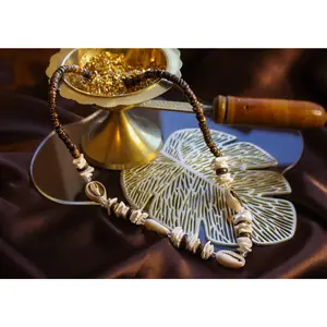 Nile Bazaar Cowrie Reign - Traditional Necklace for Men/Women – Unisex Handcrafted Boho Chic Jewelry with Coconut Beads and Puka Shells.