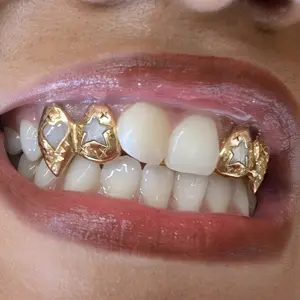 4pcs Hip-Hop Personality Double Star Fang Grillz - Golden & Black Metal Teeth Grills with Star & Accents, Trendy Accessories for Parties, Halloween, Christmas, Mardi Gras - Unisex Gifts for Men & Women, Party Teeth Grills, Festive Teeth Grills,