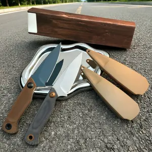The 203 EDC Fixed-Blade Knife features a compact design and a textured, non-slip handle, blending a stylish aesthetic with practical outdoor functionality.