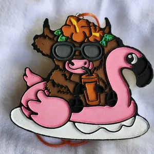 Highland cow on flamingo float car freshie.