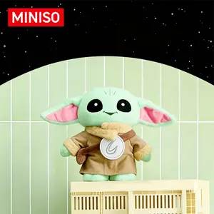 MINISO Star Wars The Mandalorian Standing Grogu Plush with Shield, crafted from soft elastic fabric and polyester filling. Lovely collectible doll, great for home decoration, perfect gift and cute companion for all Star Wars enthusiasts and plush lovers
