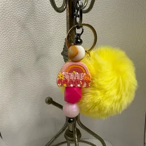 Yellow Pom Pom Keychain with Rainbow stay groove Design and Pink Beads for Stylish Accessory