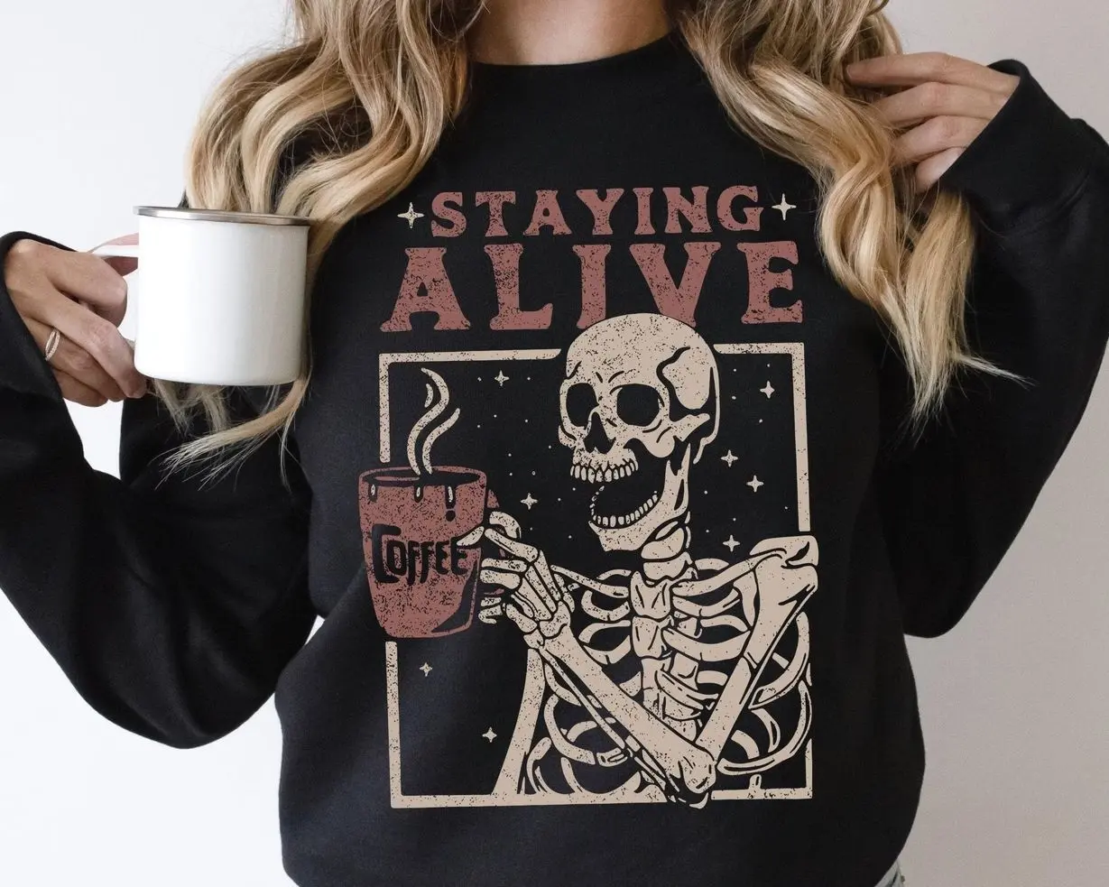 Staying Alive Coffee Sweatshirt, Funny Skeleton Sweatshirt, Halloween Retro Sweater For Women, Coffee Lover Hoodie, Spooky Season Crewneck, Skeleton Drinking Coffee Graphic Pullover, Cozy Fall Autumn Apparel, Cute Halloween Gift For Women