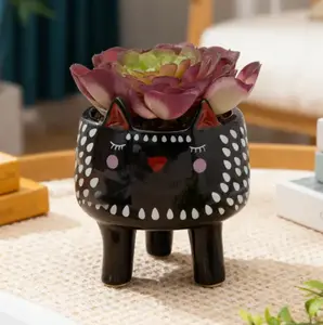 Faux Succulent in Black Ceramic Animal Planter