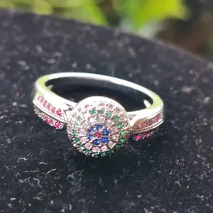 Sterling Silver Ring with Ruby, Sapphire & Emerald Accents, Featuring Central Stone and Decorative Band
