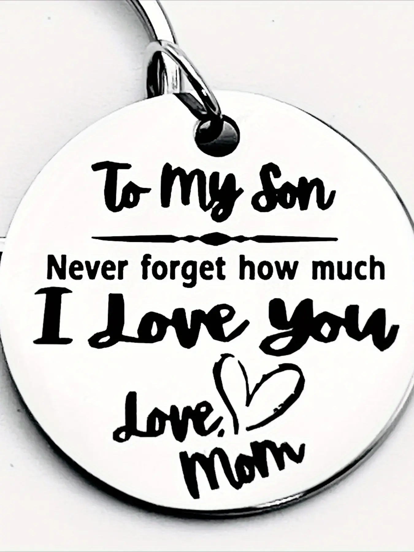 A stainless steel keychain, Heart shaped keychain, Personalized, a gift from a mother to her son - engraved with a loving note "To my son", featuring a heart shape with a letter theme, suitable as a gift accessory for birthdays, graduations