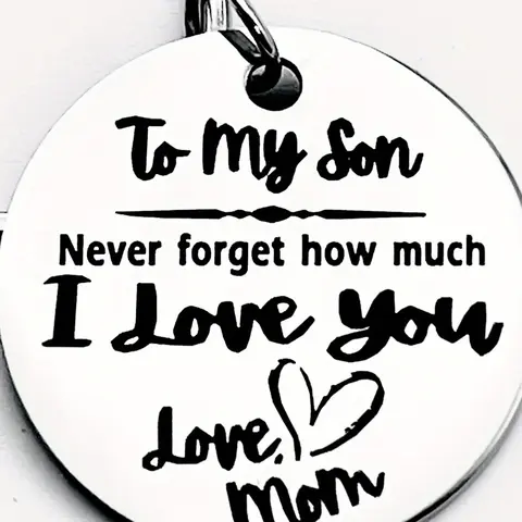 A stainless steel keychain, Heart shaped keychain, Personalized, a gift from a mother to her son - engraved with a loving note "To my son", featuring a heart shape with a letter theme, suitable as a gift accessory for birthdays, graduations