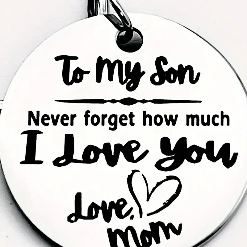 A stainless steel keychain, Heart shaped keychain, Personalized, a gift from a mother to her son - engraved with a loving note "To my son", featuring a heart shape with a letter theme, suitable as a gift accessory for birthdays, graduations