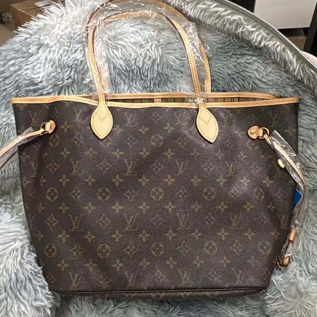 Pre-owned Louis Vuitton Monogram Neverfull MM Tote Bag Iconic Coated Canvas & Vachetta Leather 13 inch Laptop Friendly Hand sewn Craftsmanship Authentic Repaired
