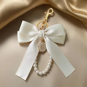 Cute Cream Bowknot Bag Charm with Faux Pearl Beaded Wrist Strap - Satin Ribbon Keychain for Women & Girls, Decorative Purse Accessory & Backpack Pendant