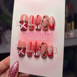 Christmas Press On Nails with Festive Red and White Designs and Gold Accents for Holiday Style