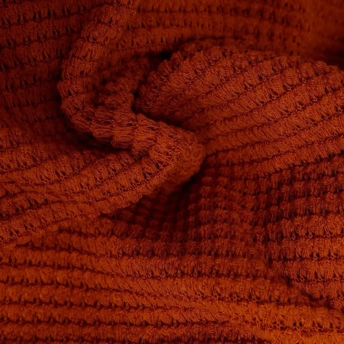 Waffle Fabric Solid Sweater fabric sold by the yard Width: 54/56" GSM: 220 GSM Material: POLYESTER, RAYON, SPANDEX 64%POLY 32% RAYON 2% SPANDEX Notes: WAFFLE FABRIC SOLID