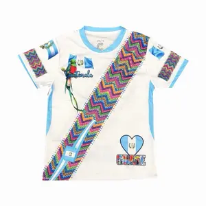 White Guatemala Típica Jersey with Traditional Colors Vibrant Design and Heart Motif for Cultural Pride.