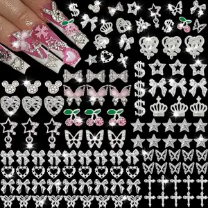 106 Pcs Nail Charms and Gems Silver Nail Charms Nail Rhinestones for Nails Design 3D Butterfly, Bow, Star,Cherry,Cross,Dollar,Heart Shapes for Acrylic Nails (19 Styles)