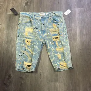 Men’s Blue Jean shorts with paint splatters