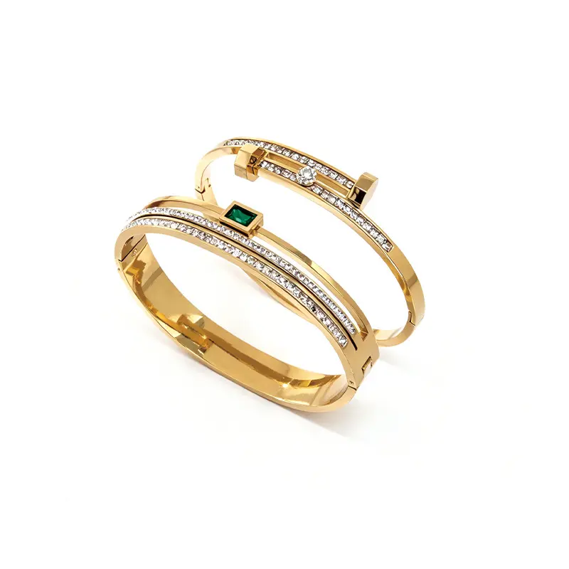 One minimalist gold bracelet featuring emerald stones and cubic zirconia set into stainless steel—women’s jewelry suitable for wearing.