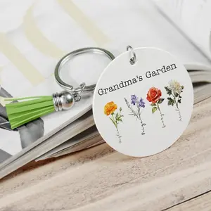 Grandmas Garden Wooden Double Sided Key Chain. This item can be personalized with Mom, Grandma, Gigi , Meme Etc. it also comes with your choice of color tassel  please give details of name when ordering.