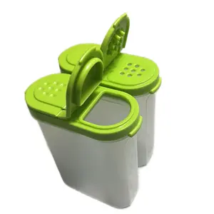 transparent salt and spice shaker with green lid