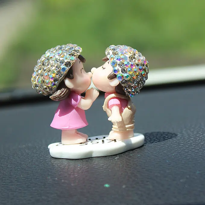 Diamond-encrusted couple figurine